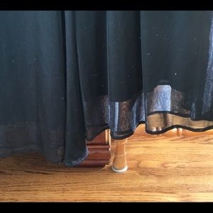 Elastic waste lined dress paints with bell bottom legs .